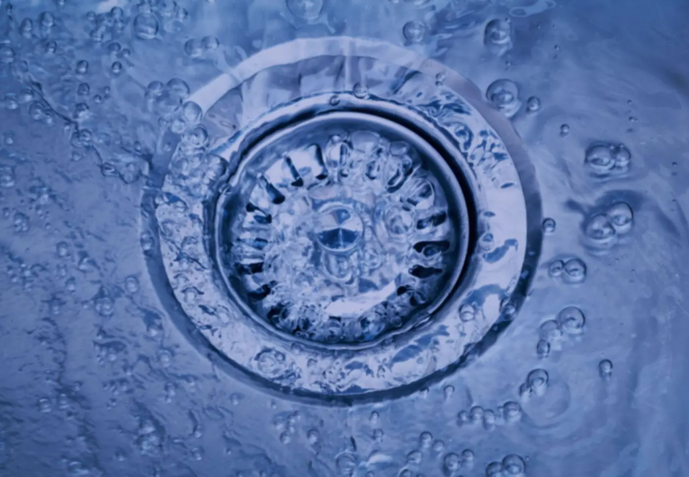Water flowing into a floor drain grate